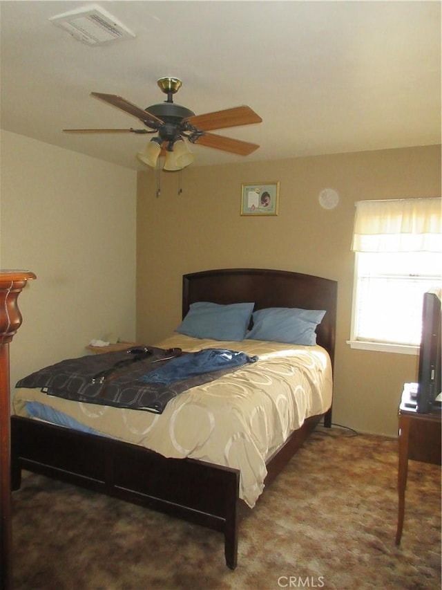 bedroom with ceiling fan and carpet floors