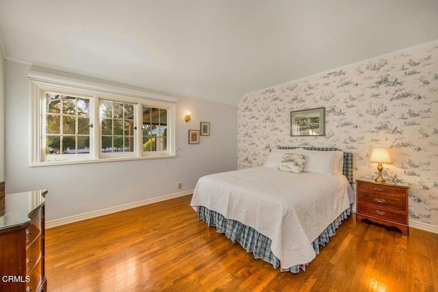 bedroom with wood-type flooring