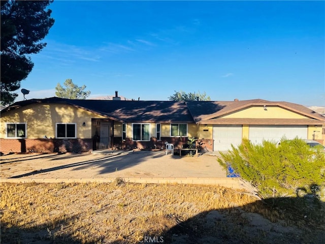 ranch-style house featuring a garage