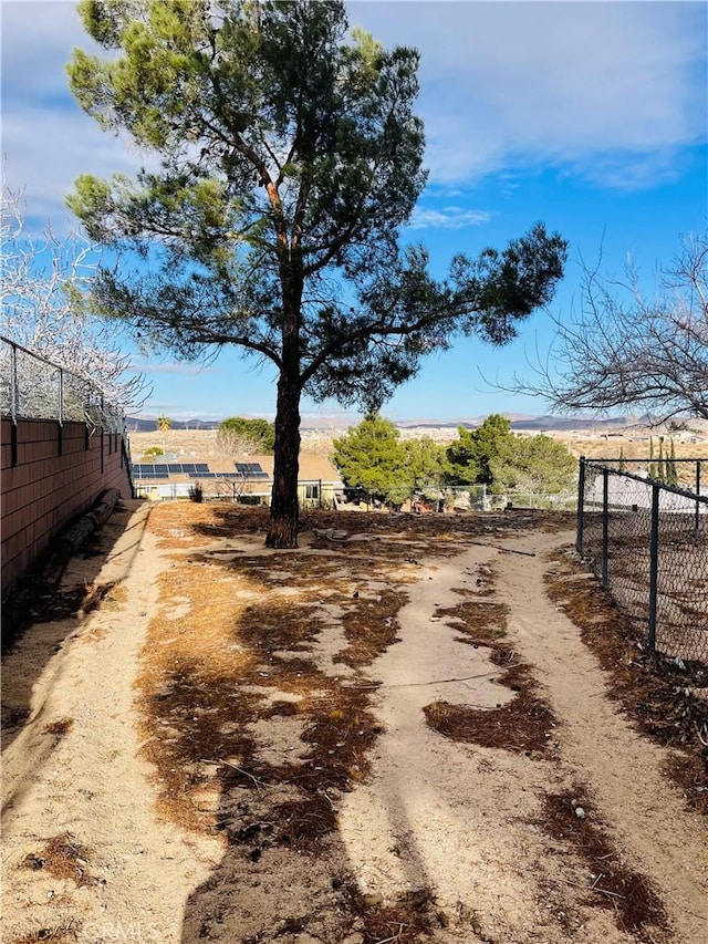 view of yard with a rural view