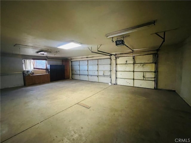 garage featuring a garage door opener