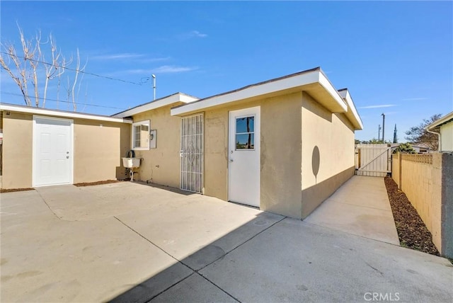 rear view of property featuring a patio