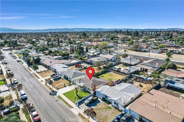 birds eye view of property with a mountain view