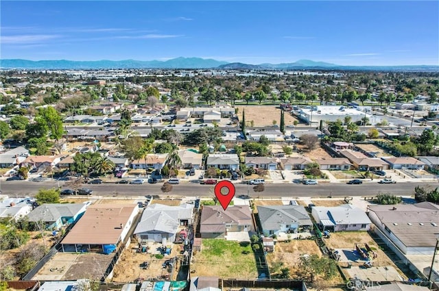 birds eye view of property with a mountain view