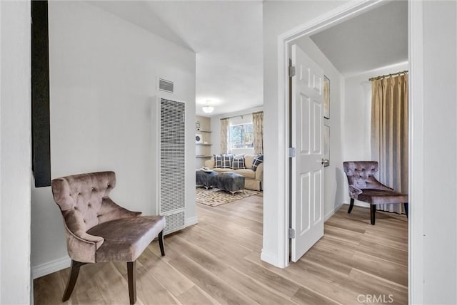 hallway with light wood-type flooring