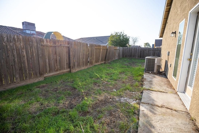 view of yard with central AC