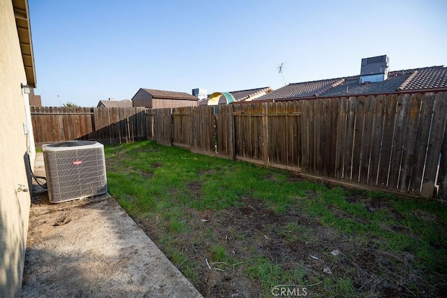 view of yard with central AC unit