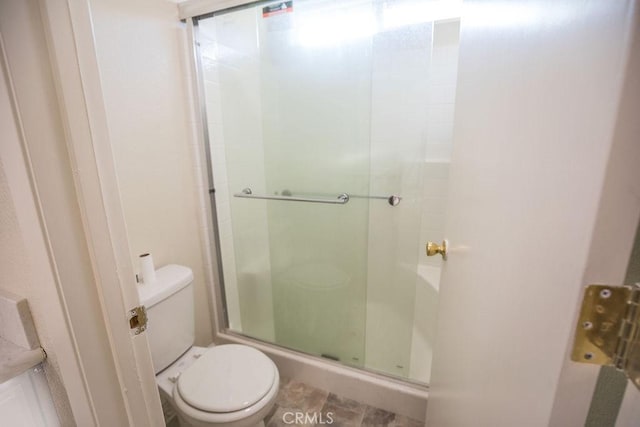 bathroom with walk in shower and toilet