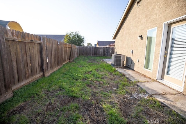 view of yard featuring central AC