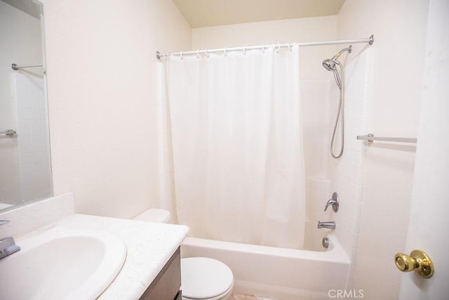 full bathroom featuring toilet, vanity, and shower / bath combo with shower curtain