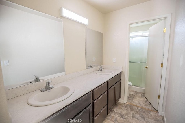 bathroom with toilet, walk in shower, and vanity