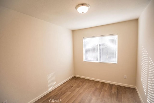 empty room featuring hardwood / wood-style flooring