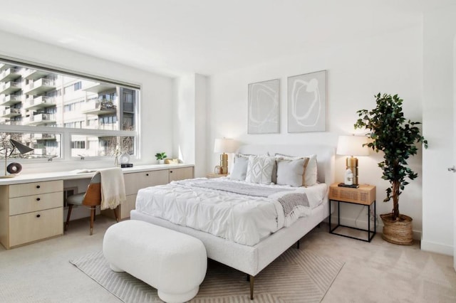 bedroom with light colored carpet