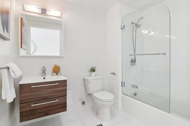 full bathroom featuring toilet, combined bath / shower with glass door, tile patterned floors, and vanity