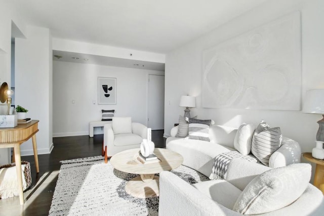 living room featuring dark wood-type flooring