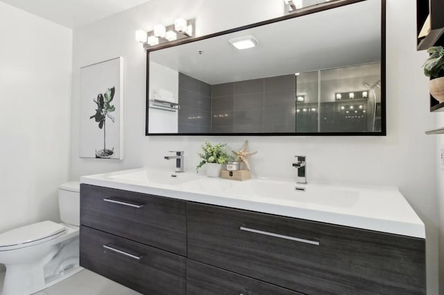 bathroom featuring toilet, walk in shower, and vanity