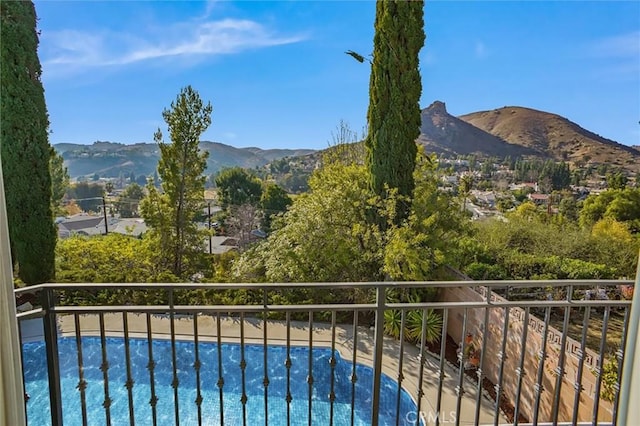 balcony featuring a mountain view