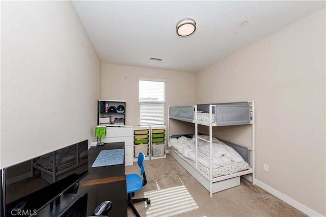 bedroom with light carpet