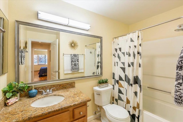 full bathroom featuring vanity, toilet, and shower / bath combo