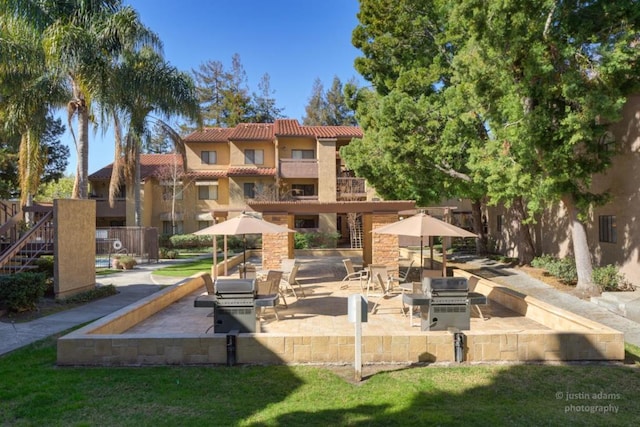 view of home's community with a patio