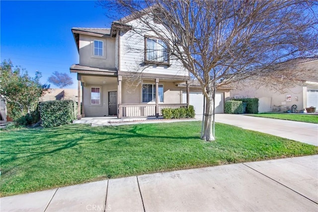 view of front property featuring a porch, a front lawn, and a garage