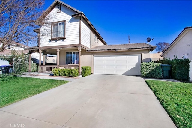 view of property featuring covered porch, a front yard, and a garage