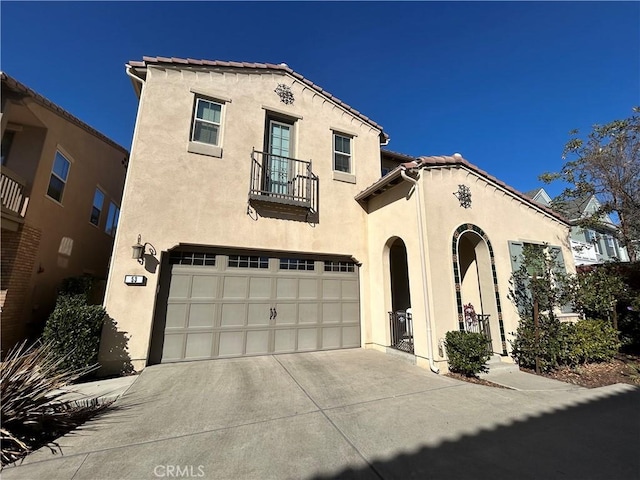 mediterranean / spanish-style home with a garage