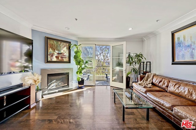 living room featuring ornamental molding and dark wood-type flooring