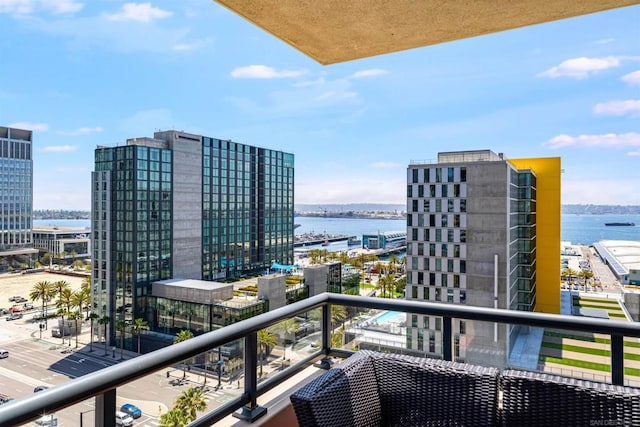 balcony featuring a water view