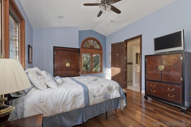 bedroom featuring lofted ceiling, dark hardwood / wood-style floors, and ceiling fan