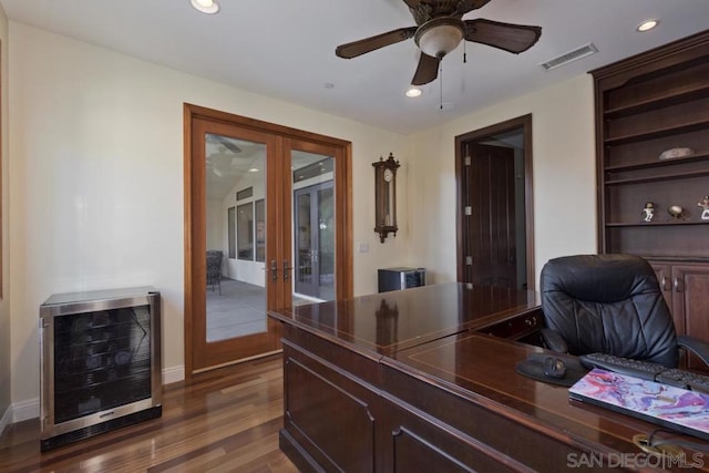 office space with ceiling fan, french doors, beverage cooler, and dark wood-type flooring