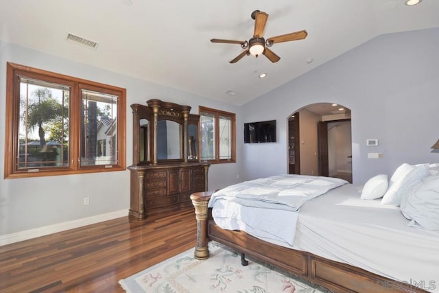 bedroom featuring ceiling fan, dark hardwood / wood-style flooring, and lofted ceiling