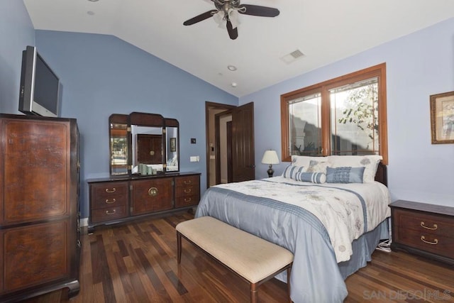 bedroom with ceiling fan, dark wood-type flooring, and lofted ceiling