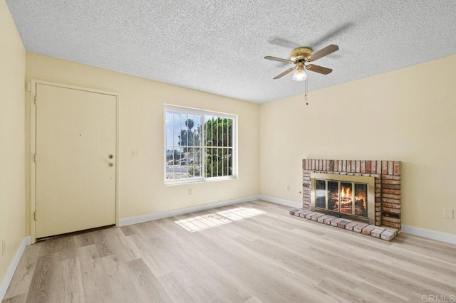 1403 Goff Ct, San Diego, CA 92114 - unfurnished living room with wood finished floors, ceiling fan, a textured ceiling, a fireplace, and baseboards