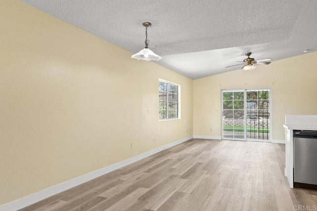1403 Goff Ct, San Diego, CA 92114 - unfurnished living room with light wood-type flooring, a textured ceiling, lofted ceiling, baseboards, and ceiling fan