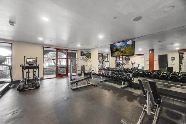 exercise room with recessed lighting