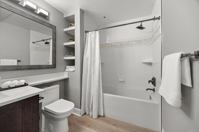 full bath featuring shower / bath combo with shower curtain, vanity, toilet, and wood finished floors