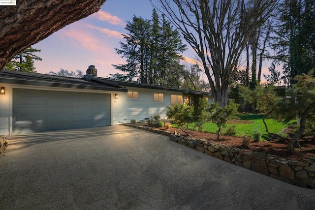 ranch-style house featuring a garage