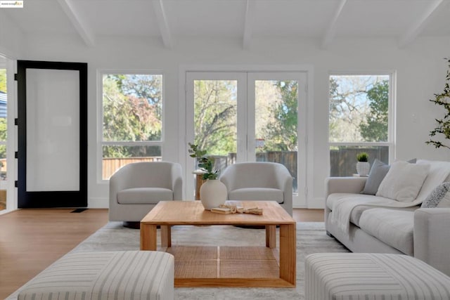 sunroom featuring beamed ceiling