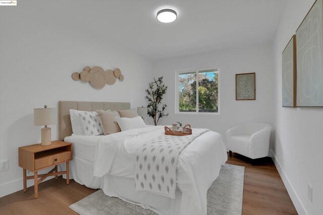 bedroom with hardwood / wood-style flooring