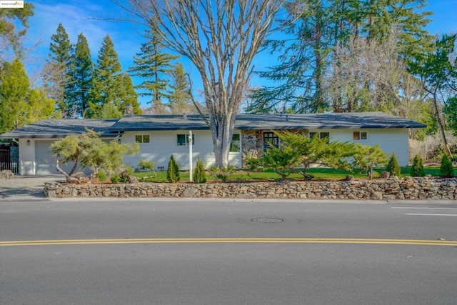 ranch-style house featuring a garage