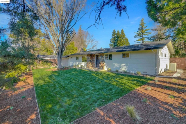 view of front of home with a front yard and cooling unit