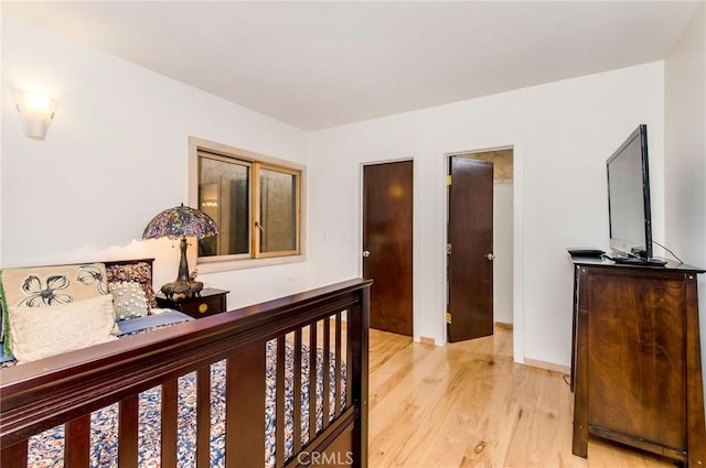 bedroom with light hardwood / wood-style floors