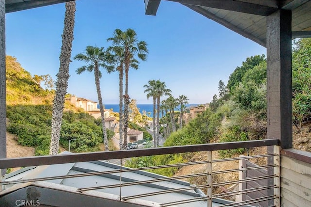 balcony featuring a water view