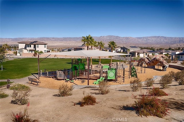 view of playground featuring a mountain view