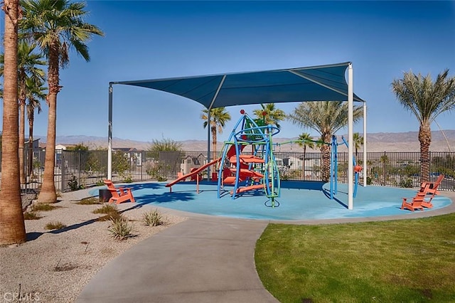 view of jungle gym with a mountain view