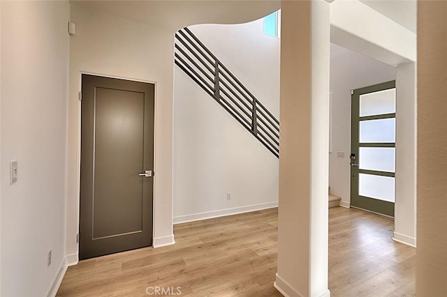 stairway featuring wood-type flooring