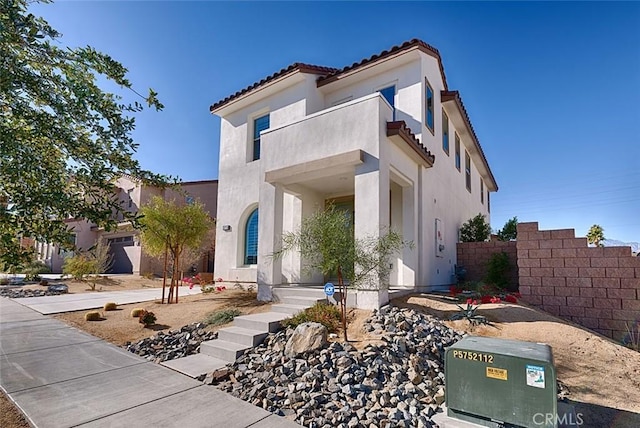 mediterranean / spanish-style home with a balcony