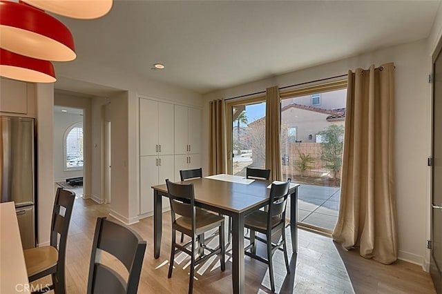 dining area with light hardwood / wood-style flooring