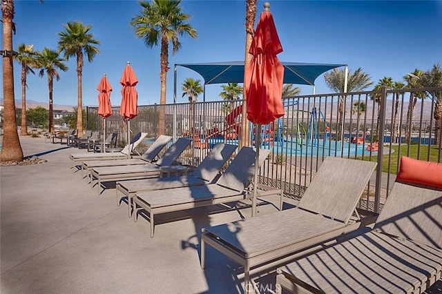 exterior space featuring a community pool and a patio